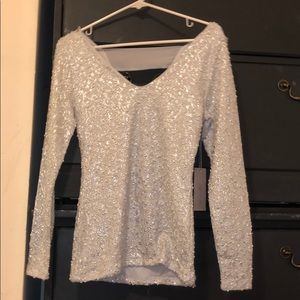 Jennifer Lopez. Detailed blouse with beaded fabric